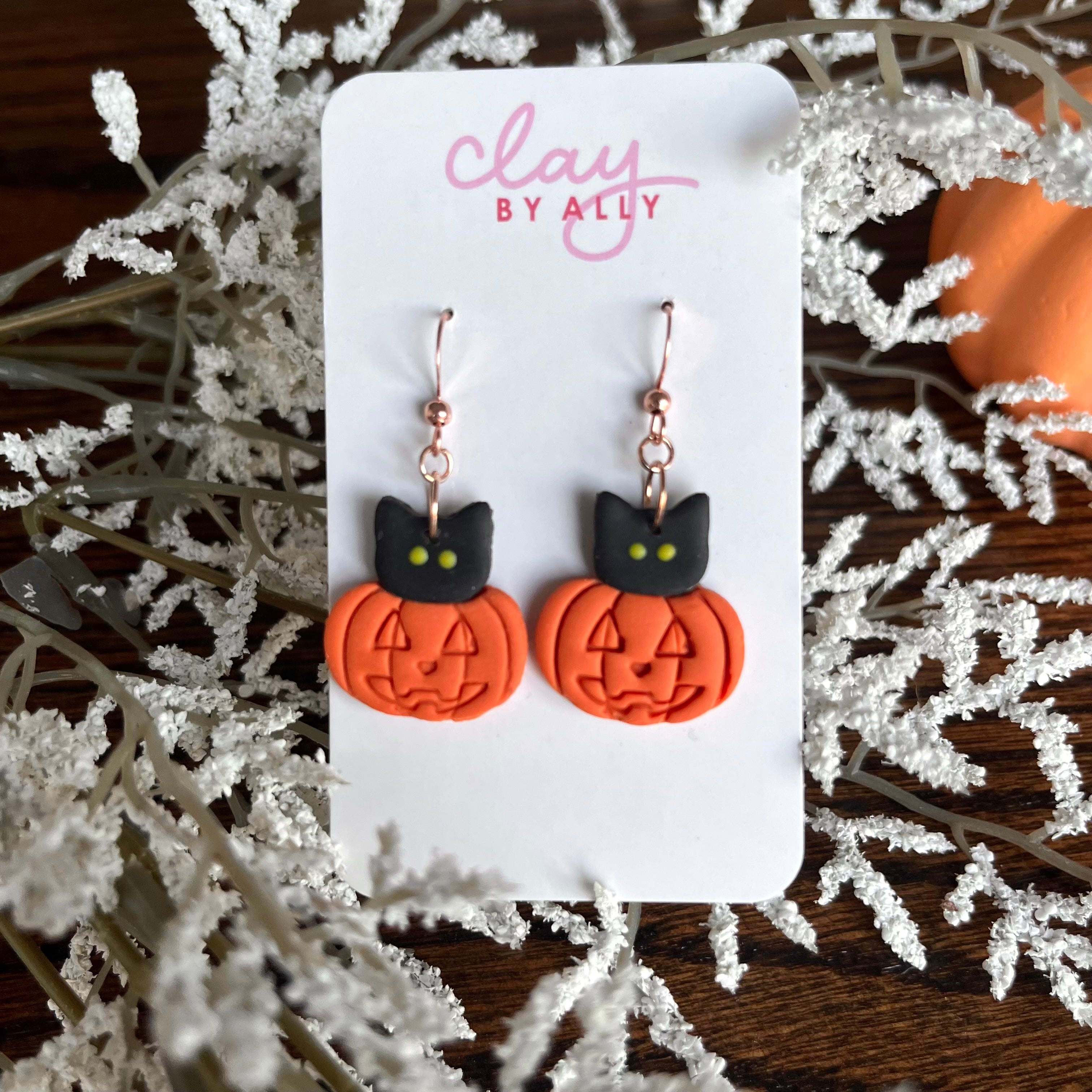 Kitties in pumpkins